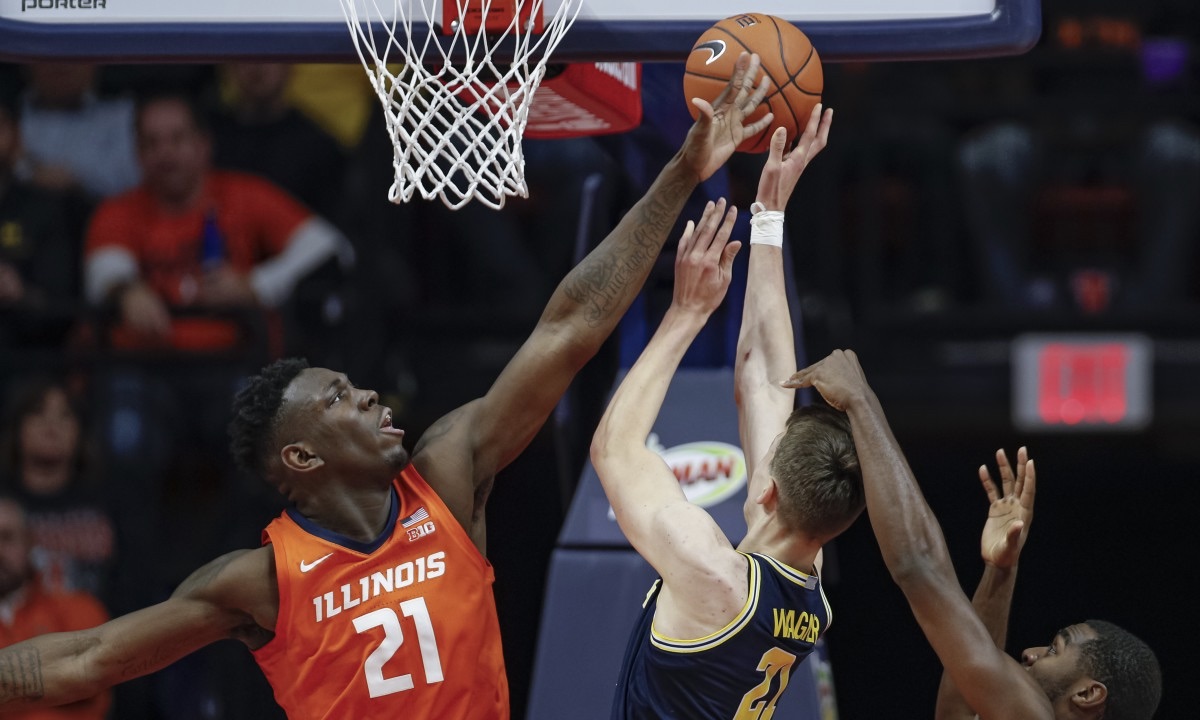 Kofi Cockburn (coe-burn) of Illinois basketball blocks a Michigan shot attempt en route to a 71-63 upset on Wednesday night.