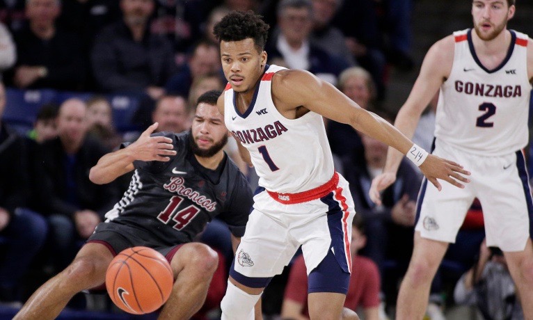 Gonzaga guard Admon Gilder (1) goes after the ball, after knocking it away from Santa Clara forward Keshawn Justice (14) during the first half of an NCAA college basketball game