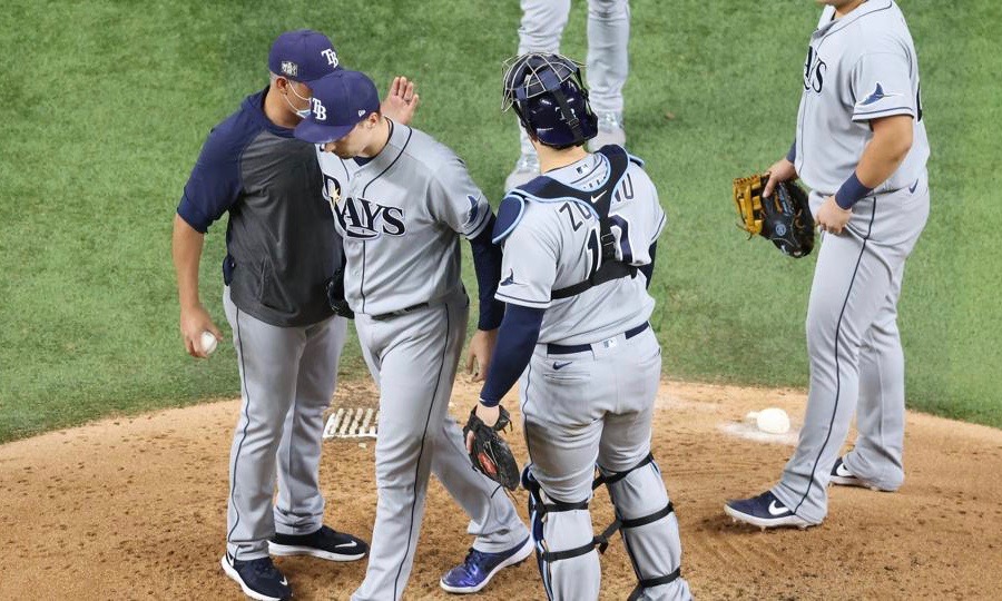 Blake Snell #4 of the Tampa Bay Rays is taken out of the game by manager Kevin Cash